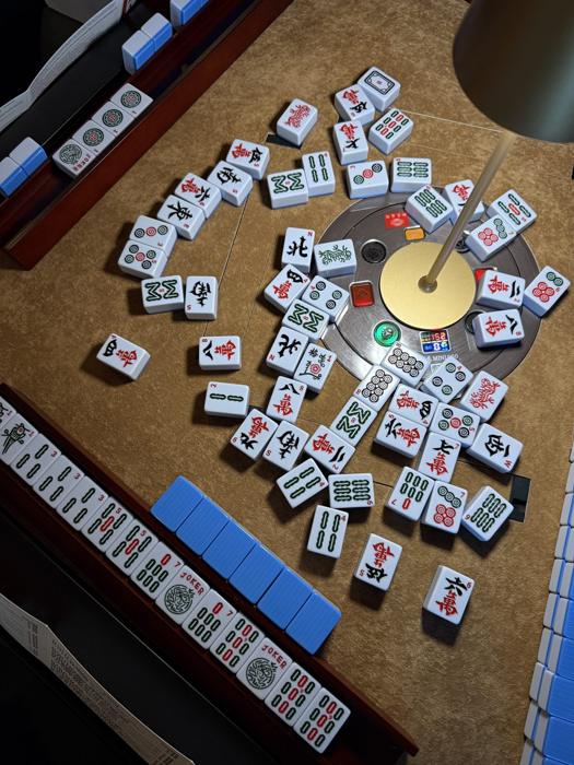 Mahjong tiles spread across a table